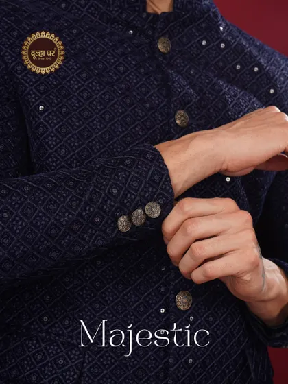 Majestic in every detail. A close-up of the navy blue textured jacket, showing the fine craftsmanship of the buttons and cuffs.