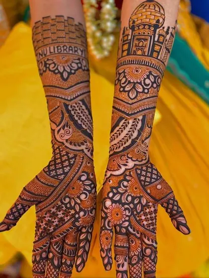 A unique bridal design featuring architectural elements like the Jharokha and the Taj Mahal, combined with personalized text for a truly one-of-a-kind creation.