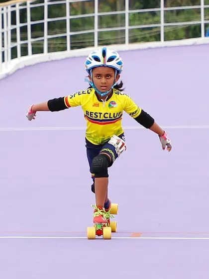 Focus and form. My daughter in her racing gear, showing great posture and determination. We teach these core skills to all our beginner skaters.