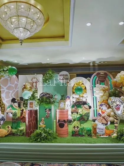 A wide view of the entire jungle safari stage setup inside a banquet hall, demonstrating how an indoor space can be completely transformed into a wild jungle.