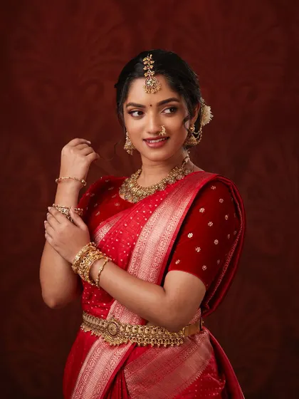A candid, happy shot that brings out the radiance of the bride and her jewellery.