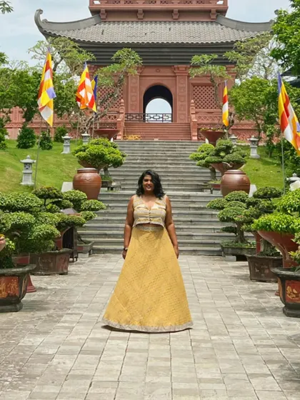 My vacation style is all about comfort. This yellow lehenga set, which I designed, was perfect for exploring. I create travel-friendly ethnic and fusion wear that is both stylish and practical.