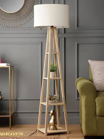 Our trending wooden shelf lamp, shown here in a stylish living room setting. The light wood finish and white drum shade complement a variety of decor styles, from modern to Scandinavian.