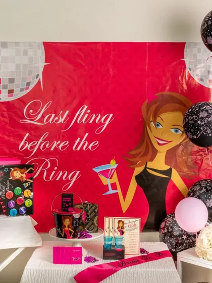 Get the party started with a "Last Fling Before the Ring" bachelorette kit. This setup includes a fun backdrop, themed balloons, shot glasses, and other party favors to ensure a night to remember.