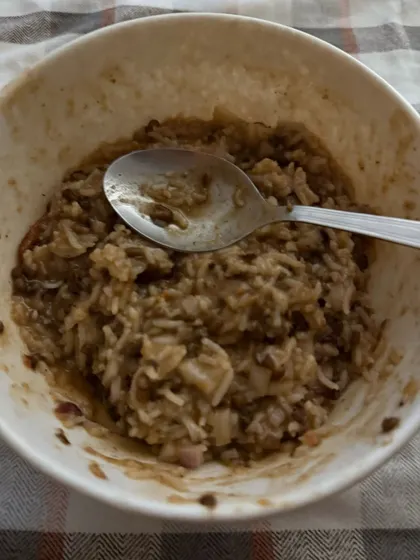 A comforting bowl of dalia or broken wheat porridge, a high-fiber and nutritious meal option for weight management.