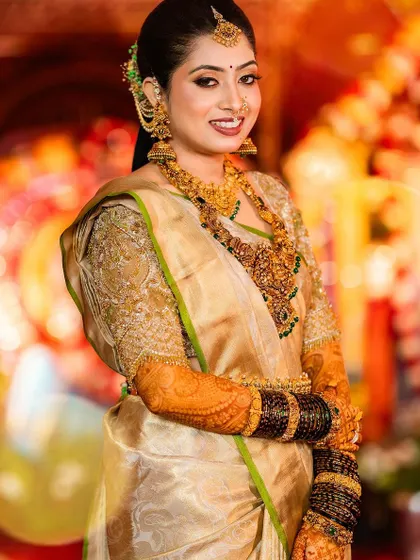 This bride looks stunning from every angle. The intricate embroidery on her gold blouse is a true work of art.