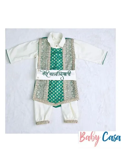 "Meri Pehli Diwali." This traditional green and white kurta set with a personalized sash is a wonderful way to mark your baby boy's first festival of lights.