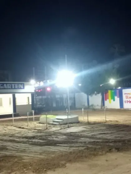 A "before" shot of the kindergarten grounds at night, just before my team started the transformation.