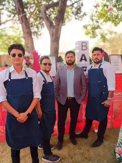 Our professional bartending team, dressed in smart uniforms, ready to serve at a beautiful destination wedding. We ensure our staff is as well-presented as our bar setups.