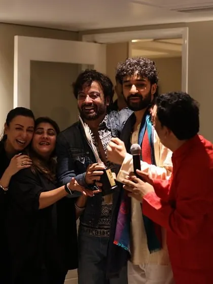 A joyous group hug celebrating the success of our friends. True happiness is found in celebrating the achievements of others.