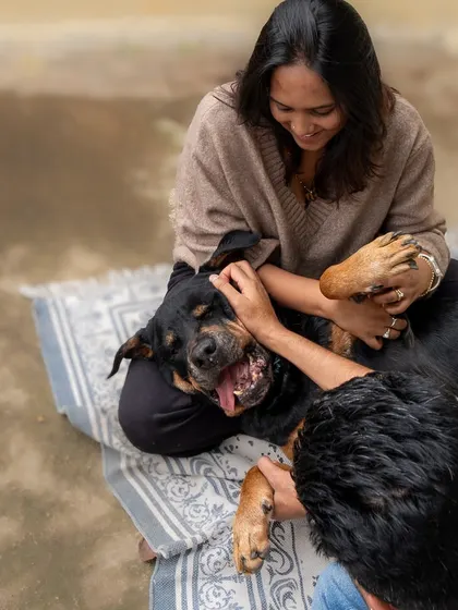 A candid moment of play and cuddles on a rooftop. This photo perfectly captures the fun and affection in this family.