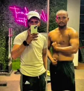 I know how to endure and how to overcome. A post workout photo with a client, showing the results of our shared dedication.