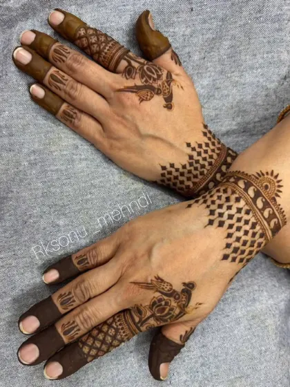 An elegant and modern design for Eid celebrations. It features a crescent moon motif combined with delicate floral patterns and geometric checkerboard designs on the back of the hands.