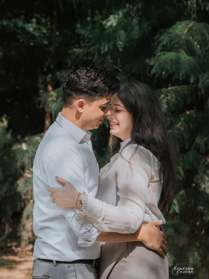 An intimate embrace surrounded by nature. This close-up of Shivam and Raghavi during their park pre-wedding shoot focuses on their gentle connection and happy smiles.