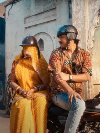 Creating a realistic and humorous moment in the Starsports ad by styling this couple in traditional Rajasthani attire, complete with a ghunghat for the woman.
