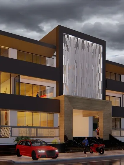 A design visualization for a modern commercial complex. The concept features a dramatic, illuminated central facade element and clean, horizontal lines to create a bold and contemporary architectural statement.
