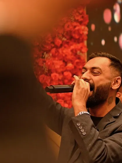 A close-up shot of me, fully immersed in the performance at the engagement party. The passion you see is real, I live for these moments.