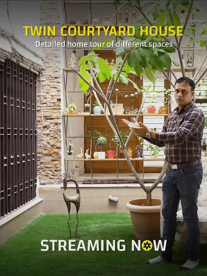 Our principal architect giving a tour of the courtyard space, explaining how the design brings nature into the home. We believe in a collaborative process, and this image reflects our hands-on, explanatory approach.
