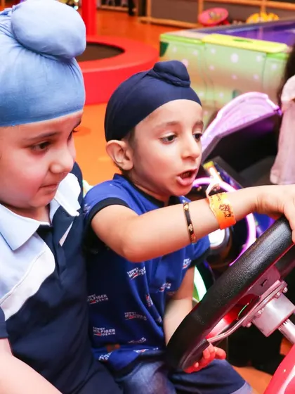 Teamwork makes the dream work! Two friends team up to take on one of our exciting arcade driving games. It's a great way to enjoy some friendly competition.