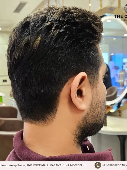 The clean neckline and tapered sides are essential for a polished men's haircut. It's all in the details.