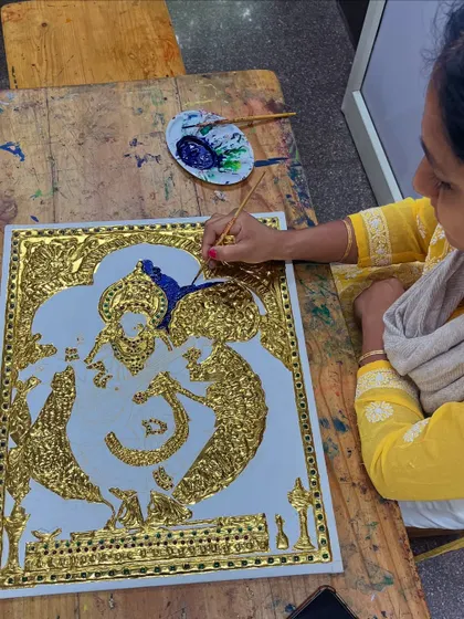 A student works independently on her Tanjore art, showcasing the skills and confidence she has built during our classes.