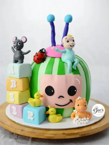 Another view of this popular Cocomelon cake, showing the colorful alphabet blocks.
