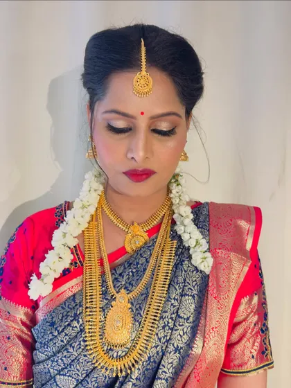 Another angle of Gulista's bridal makeup. I used a soft shimmer on the eyelids and a classic red lip, a timeless combination that photographs beautifully.