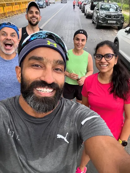 A happy group selfie during a run. You can see the mix of effort and enjoyment on everyone's faces. This is what our tribe is all about.