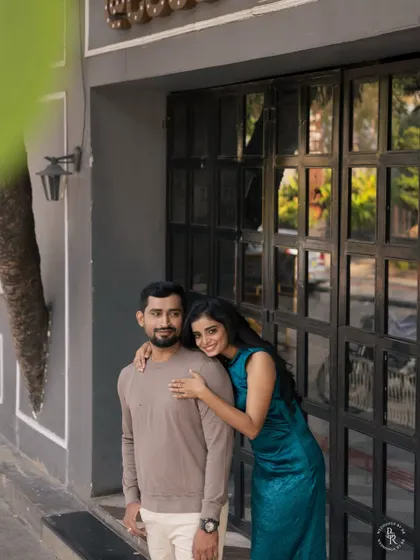A sweet and simple moment of affection. This candid embrace during their urban photoshoot highlights their easy and comfortable love for each other.