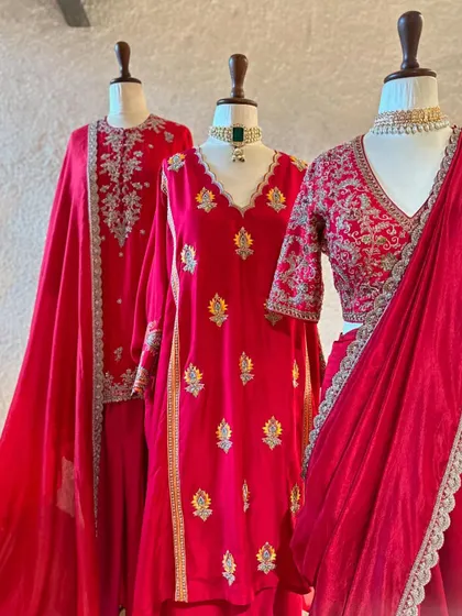 A closer look at the variety of red outfits available. From a ready-to-wear saree to an embroidered kurta, I can help you find the perfect red for your special day.