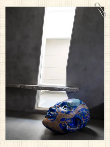 A sculptural head by a contemporary artist is placed thoughtfully by a skylight in the Kumar Residence. The play of light and shadow on the form highlights its texture and brings it to life.