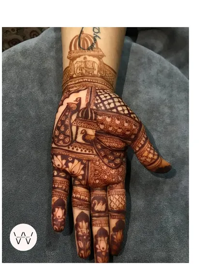 A slightly different version of the royal peacock design, with a name written on the wrist.