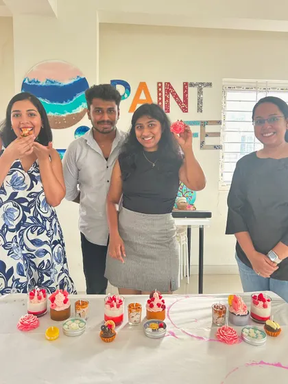 A group poses with their impressive array of dessert candles, showcasing the variety of designs possible in our workshops.