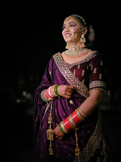 A candid shot of the bride smiling, captured in a moment of pure happiness during her wedding festivities.