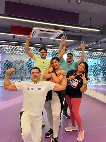Flexing and smiling after a great session. I love the camaraderie and spirit of my fitness group.