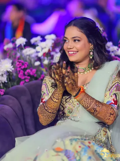 A candid photo of the bride enjoying the music and atmosphere at her engagement party.