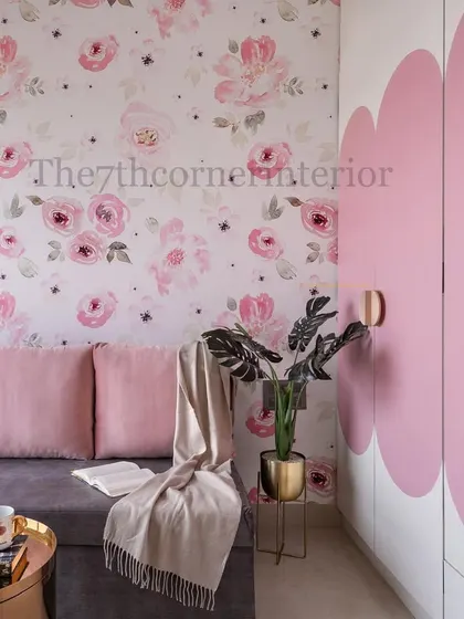 This kids' room from the 'Royal Mansion' project features a playful floral wallpaper and a unique wardrobe design with large, pink, cloud-shaped panels, adding a touch of whimsy and fun.
