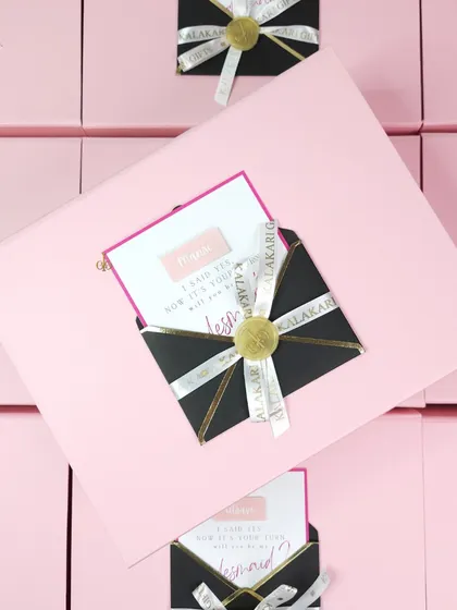 My signature dual-color gift boxes add an extra layer of elegance. Each box comes with a custom-designed note card held in a stylish black envelope, sealed with a wax stamp for a personal touch.