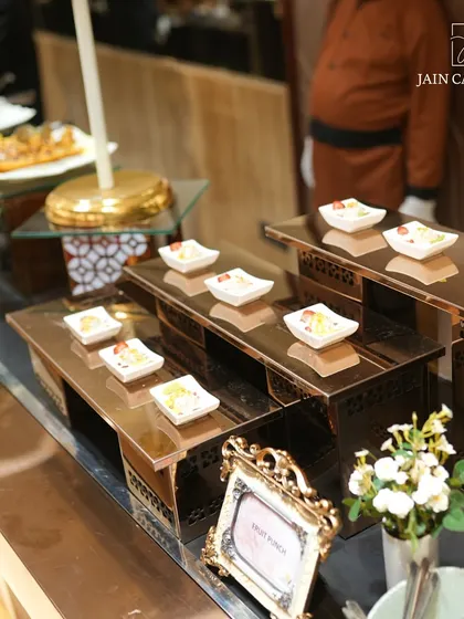 Celebrate sweetness with Jain Caterers. Our fruit punch and other small dessert bites are displayed on elegant, multi-tiered stands.