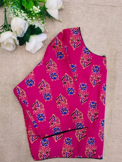 The pink leaf-printed cotton boatneck blouse.