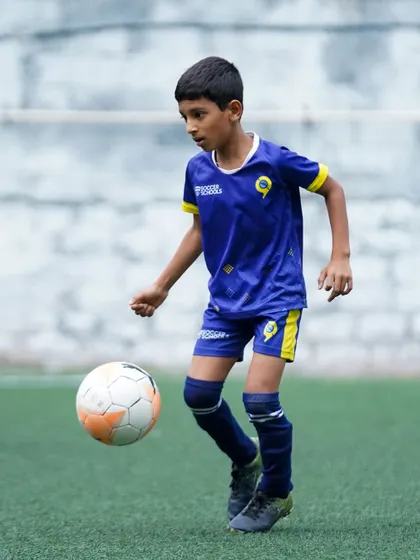 A player dribbles with confidence during the Sporthood trials. We create a supportive environment for players to perform their best.