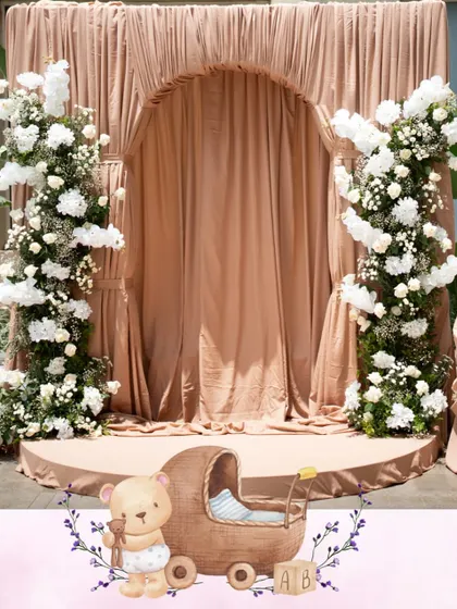 For a classic and intimate baby shower, we used a soft Mocha Mousse color palette to create a world of gentle sophistication. Layers of custom drapes and delicate white florals came together to wrap the celebration in calm, grace, and warmth.