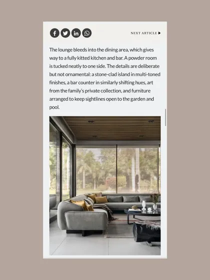 This page from the Architecture+Design feature focuses on the open-plan lounge and dining area, noting how the furniture was arranged to maintain clear sightlines to the garden and pool.