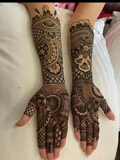 A full-sleeve design with a mix of bold, traditional motifs and delicate filler patterns.
