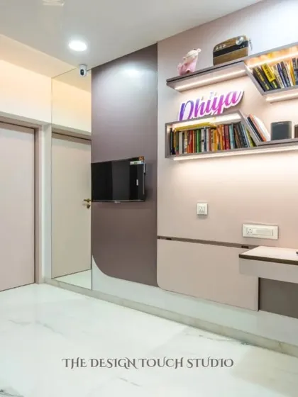 This image shows the room in its study and play configuration. The floating shelves with integrated lighting provide a perfect spot for books and decor, while the hidden study table offers a dedicated workspace.