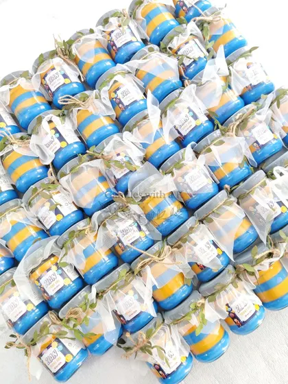 A large order of Dragon Ball Z and space-themed layered jar candles for a first birthday in Chennai.