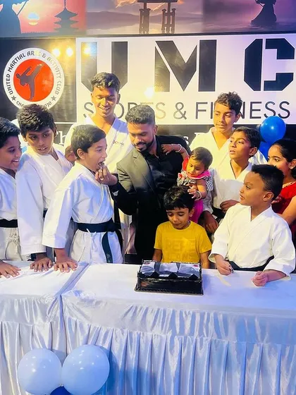 A celebration with cake for our new black belts. We believe in celebrating every major achievement as a team.