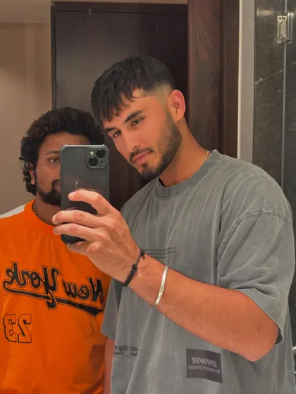 A fresh cut for Nehal Wadhera of the Mumbai Indians. This is a modern crop with a clean fade, perfect for a young athlete.