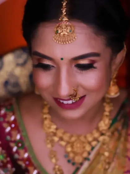 A soft, smiling portrait of Rachana. This captures the gentle side of the bridal look, showing its versatility for different moods and photos.