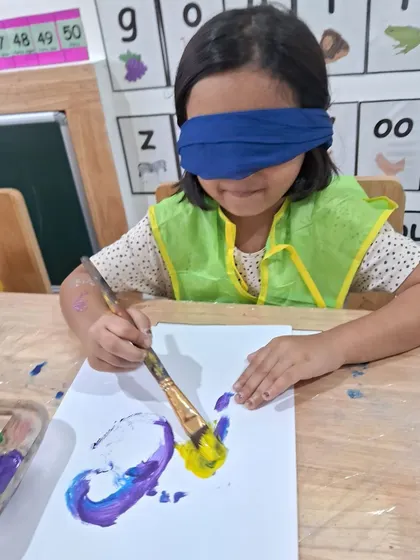 Have you ever tried painting blindfolded? This activity encourages children to rely on their other senses, like touch and memory, to create art.